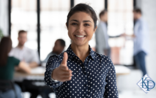 smiling recruiter reaching out for a handshake