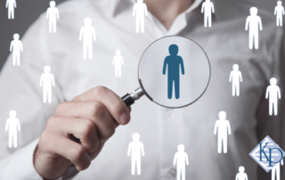 recruiter with magnifying glass - how to find a recruiter