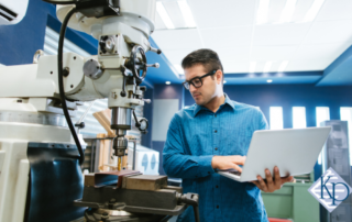 young mechanical engineer doing tests with machinery